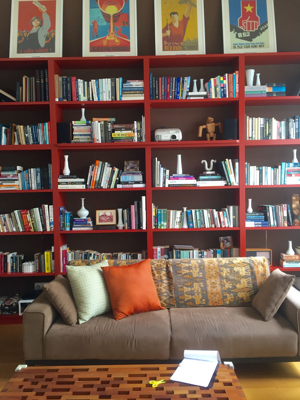 Library with custom high gloss shelves and client's own art above.