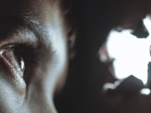 person looking through a hole
