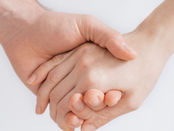 Two people holding hands