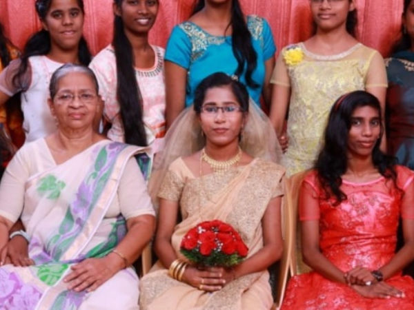 a group photo of a bride's family
