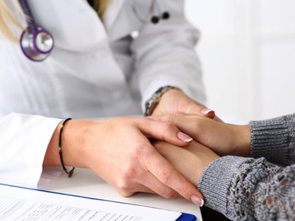 A doctor helping her patient