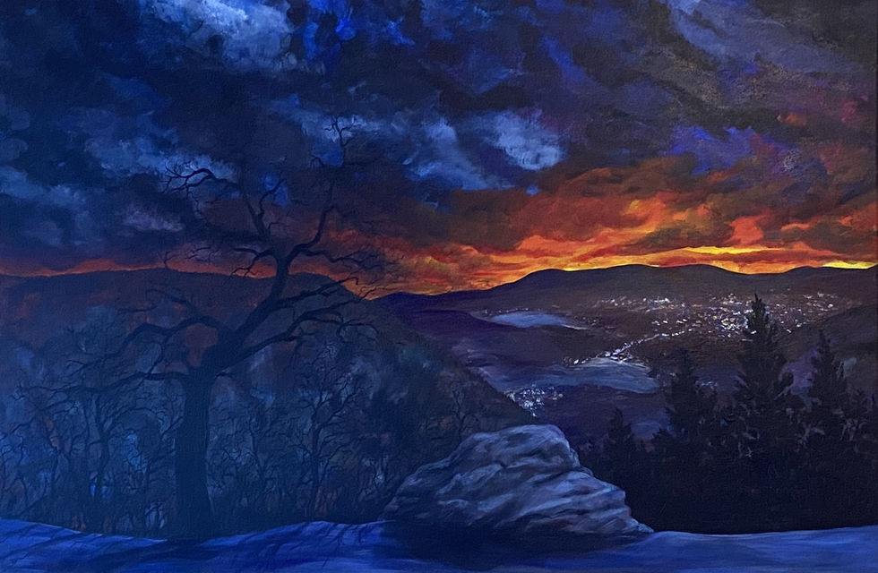 A dark snowy landscape at dusk with turbulent blue clouds and hints of yellow and red near the horizon. The lights of a city twinkle in the valley below. In the foreground, a bare tree stands next to a large boulder, overlooking the scene.