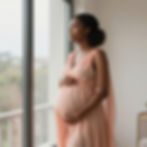 Pregnant woman looking out window, maternal support services