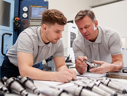 Two men working together in an engineering workshop