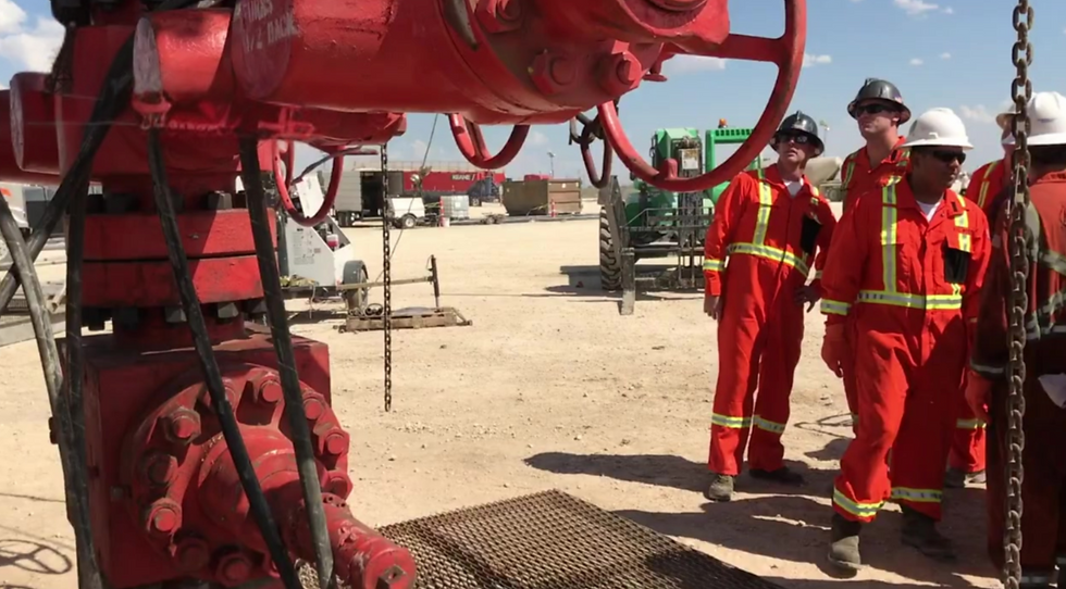 RIg workers on a well servicing rig
