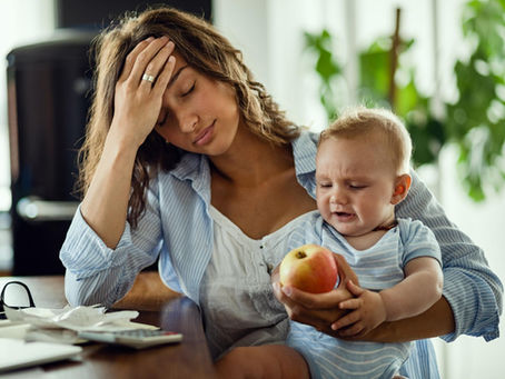 Woman struggling to be present with her child.