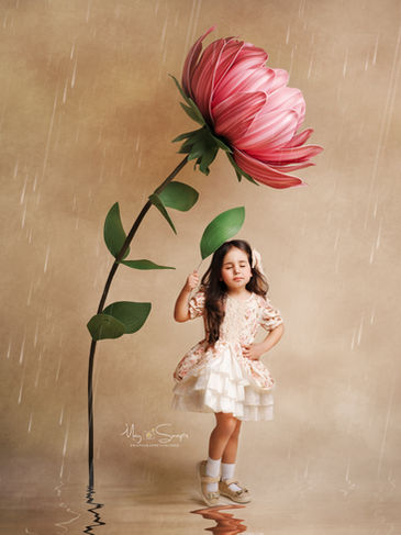 Photographe enfant Bazemont - portrait pluie et fleur géante