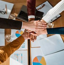 top-view-people-putting-hands-together-agreement-meeting.jpg