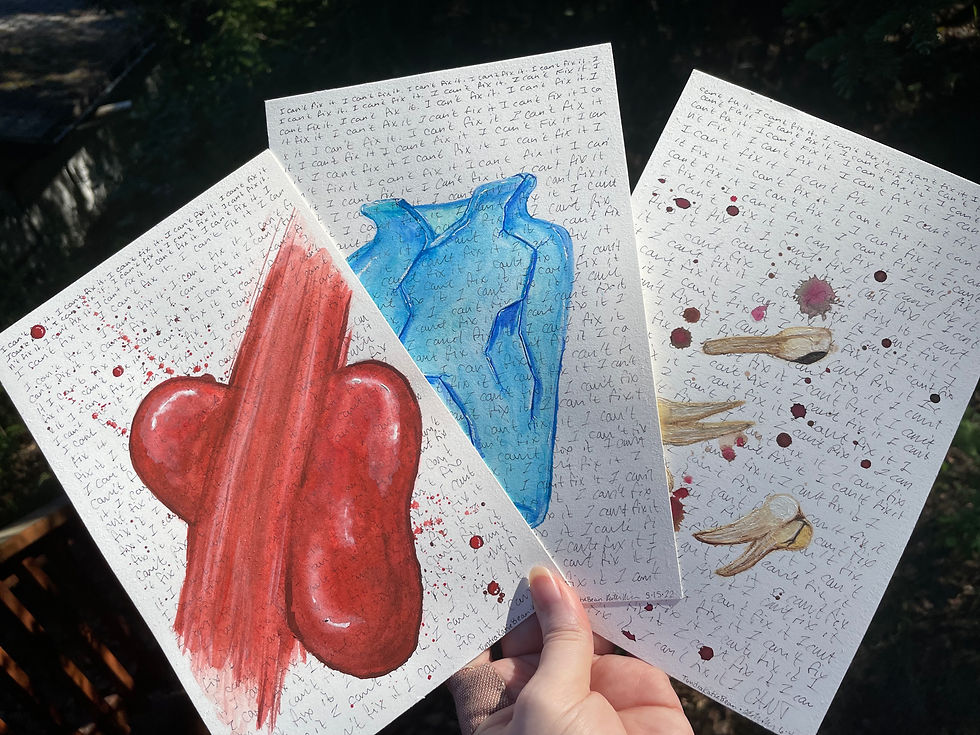 A hand holding three painting fanned out.