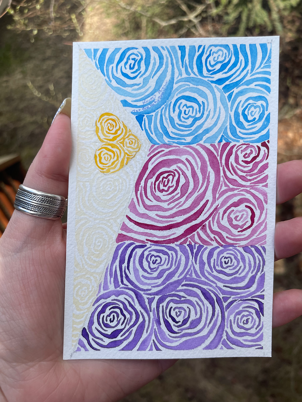 A painting of roses in the colors of the heart polyam pride flag