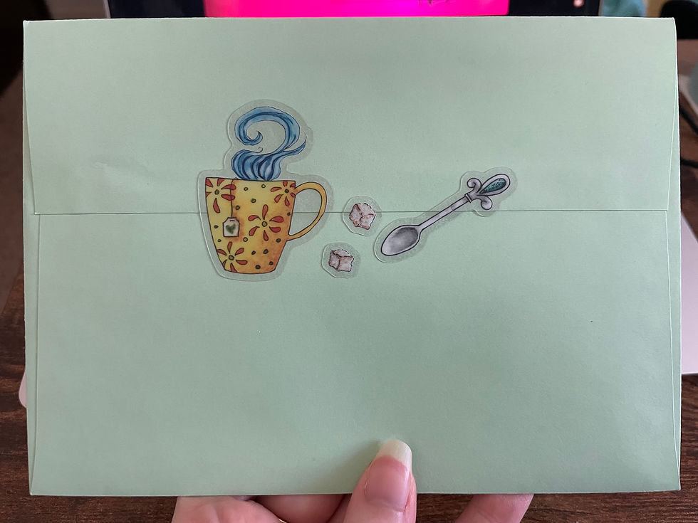 Thumbnail: The back of an envelope with the mug of tea, sugar cubes, and teaspoon stickers holding the flap closed.