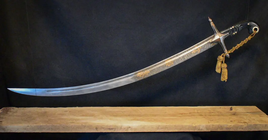 Curved blade, Damascus, gold engraving, gold, tassel, horn, cast bronze
