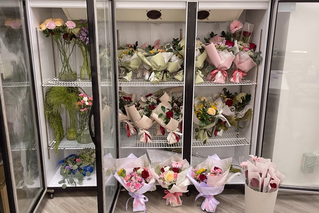 Open Bloom Floral preparing multiple flower bouquets for an event
