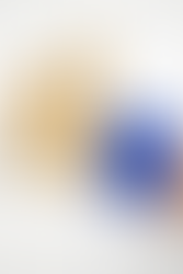 Fallout Baking Bundle that comes with: a blue apron with an all-over Vault Boy print and Vault-Tec logos, a Vault Boy thumbs up oven mitt, and a Power Armor helmet silicone mold, housed in a custom designed gift box