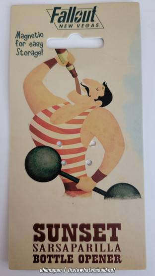 2.75" Sunset Sarsaparilla from Fallout: New Vegas metal bottlecap opener. Shown on a matching card backing with a Strongman drinking a bottle, with text that says Fallout: New Vegas on top, Magnetic for easy storage in the left upper corner, and Sunset Sarsaparilla Bottle Opener on the bottom