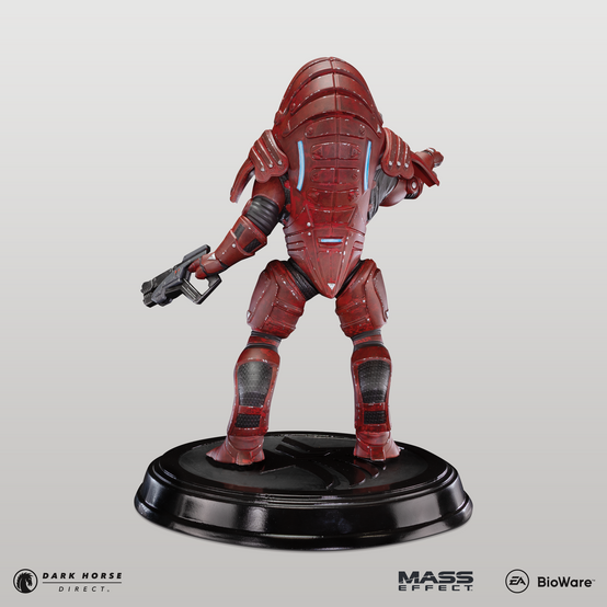 Statue of Urdnot Wrex from Mass Effect pointing with his right hand, shotgun in his other hand