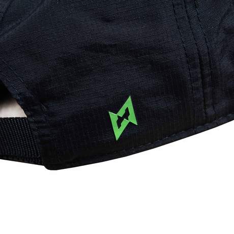 Black, multi-panel hat with a Vault Boy from Fallout face printed in bright green on the front, and Vault-Tec text logo printed in bright green on the side