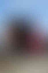 black Red Rocket from Fallout mug with a circle logo on the front of the mug and custom rocket shaped handle in red, side view