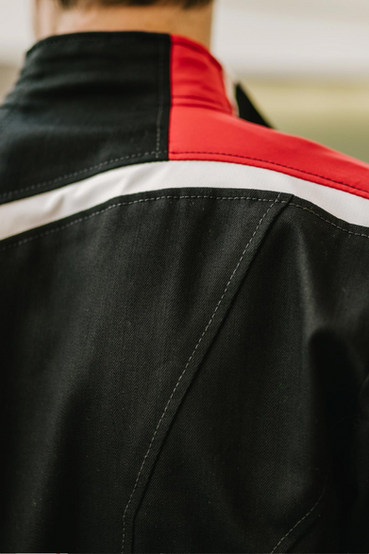 A very stylized Commander Shepard N7 jacket made out of heavyweight denim fabric, with a silicone N7 patch over the right chest and signature white/red stripes running along the right sleeve