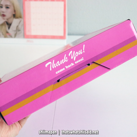 Side view of the Slocum's Joe Franchise Kit from Fallout that shows a square pink box and text that says: Thank you! come back soon!