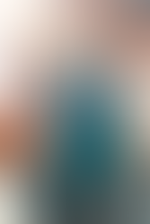 Winter parka by Volante Design, modeled after Garrus Vakarian from Mass Effect. It features a high collar mimicking a Turian's with a spacious hoodie attached, with a Turian Blue outer shell fabric and bold white accents