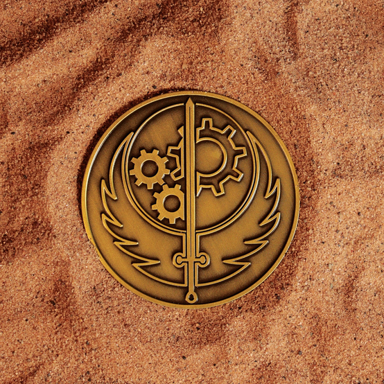 Brotherhood of Steel from the Fallout series metal medallion in gold, featuring a large gear logo on the front, while on the back there's a smaller gear logo and text that says AD VICTORIAM. It also comes with a T-60 Power Armor helmet emoji vinyl sticker, display stand, and presentation box