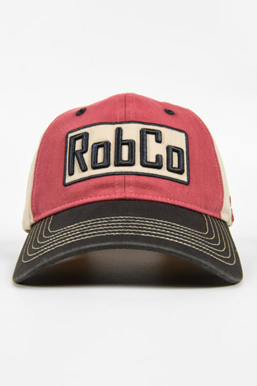 Trucker hat featuring a 3D embroidered RobCo logo from Fallout on the front, with light red/beige panels, and a curved black bill with beige contrast stitching