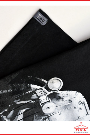 A large print graphic of the T-60 Power Armor from Fallout printed on a black t-shirt, as part of Bethesda Gear's Over Powered Apparel line