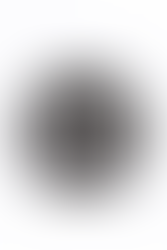 A glass replica of Nuka-Cola Dark (Nuka Dark) from Fallout soft drink in the rocket bottle design. The bottle itself is tinted in a blackish brown color, with front soda label saying 'Nuka Dark Cola' in white on a dark brown background. Also pictured are loose metal bottlecaps that match the Nuka-Cola Dark label