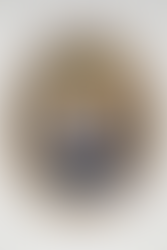 Lenticular print of Vault Boy from Fallout, it's a portrait style print that shows Vault Boy wearing a suit and bowtie doing his signature winking pose, the print also has an ornate oval frame