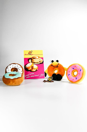 Slocum's Joe from Fallout box set that includes: an art print, 4 donut plush toys, and an enamel pin