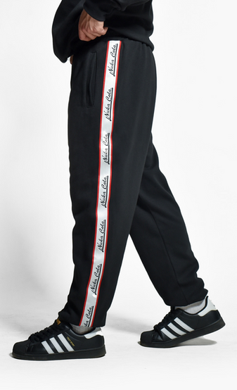 black joggers with side pockets and back pocket on the left side, with Nuka-Cola from Fallout stitched stripe detail going down the sides