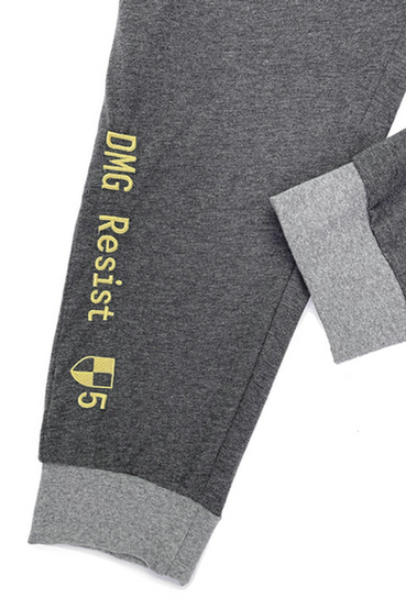 Vault-Tec from Fallout themed t-shirt and lounge pants pajama set in dark grey with light grey contrast bands. The t-shirt has a yellow Vault-Tec logo on the left front, and Vault Boy hang tag on the front right hemline, while the lounge pants have a Vault-Tec tag over the left front hip and 'DMG Resist' text on the bottom right leg