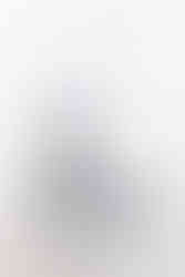 Mini statue based on Acquired Taste from Fallout, with Vault Boy sitting at a dinner table questioning whether he should eat the severed foot on a plate in front of him