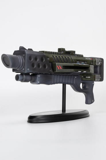 M-300 Claymore shotgun from Mass Effect desktop sized miniature replica, scaled down to 12" long or 47% of the original in-game size. It comes attached to a base with a silver color plate engraved with the Mass Effect logo and the edition number