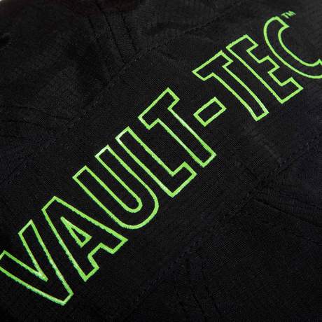 Black, multi-panel hat with a Vault Boy from Fallout face printed in bright green on the front, and Vault-Tec text logo printed in bright green on the side