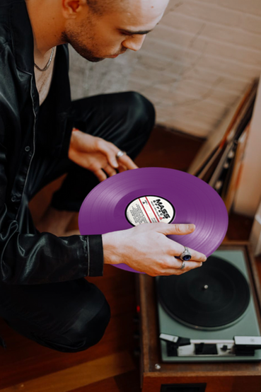 4 LP vinyl soundtrack set for Mass Effect. The front is all white with an N7 outline in black and red, and it folds out housing 4 colored vinyls in purple to represent Tali Zorah