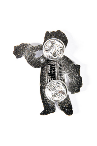 Enamel pin of Vault Boy from Fallout, who is holding a bottle of Nuka-Cola in each hand. The left arm is hinged so that he can drink out of the bottle, it also comes on a matching card backing that says 'ZAP THAT THIRST!' on the top, with the classic Nuka-Cola text logo and bottle rocket on the bottom