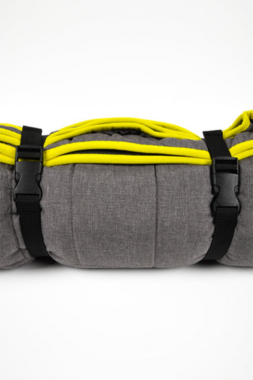 Vault-Tec from Fallout themed survival blanket: the blanket itself is grey with a custom quilted pattern featuring the Vault-Tec logo and custom Vault-Tec patch in one corner, which also rolls neatly with the use of a black carrier strap that has a yellow Vault-Tec logo embroidered on it