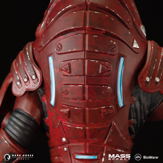 Statue of Urdnot Wrex from Mass Effect pointing with his right hand, shotgun in his other hand