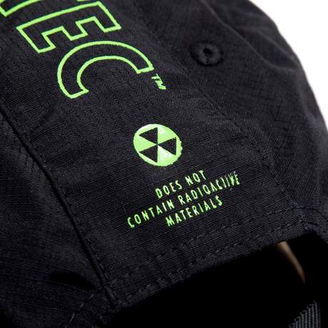 Black, multi-panel hat with a Vault Boy from Fallout face printed in bright green on the front, and Vault-Tec text logo printed in bright green on the side