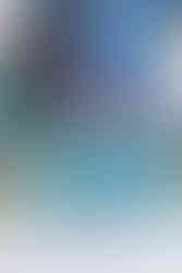 Collectible resin statue of an X-01 Power Armor from Fallout with the Nuka-Cola Quantum paint variant