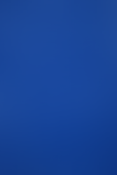 Double sided scarf that has a repeating Mass Effect ship blueprint pattern on one side, and black on the other side with an embroidered Spectre logo on one corner