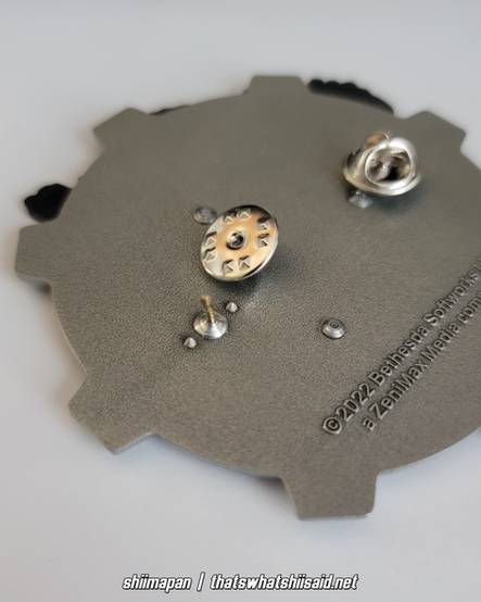 Liberty Prime from Fallout 4 large enamel pin, shown getting ready throw a mini nuke in his right hand. The mini nuke and his visor have colored enamel detail.