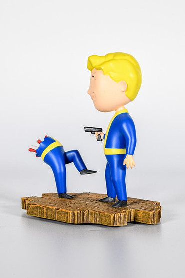 Vault Boy fromFallout technicolor variant mini statue based on the Bloody Mess perk. On the left side is one Vault Boy with the upper half of his body blown away and on the right side is another Vault Boy who's grinning while holding a gun