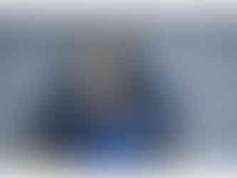 PVC figure of Garrus Vakarian from Mass Effect, sporting his Mass Effect 2 gear before you acquire him in your squad, trusty sniper rifle in hand, standing on top of a black base with the Paragrade (Paragon and Renegade morality symbols combined)