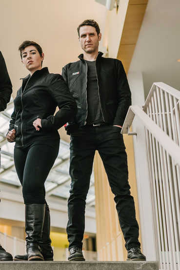 A very stylized Commander Shepard N7 jacket made out of heavyweight denim fabric, with a silicone N7 patch over the right chest and signature white/red stripes running along the right sleeve