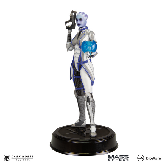 PVC figure of Liara T'Soni from Mass Effect, as seen in her Mass Effect 3 outfit, with a heavy pistol in one hand and her trusty assistant Glyph in the other, standing on top of a black base with the Paragrade (Paragon and Renegade morality symbols combined)