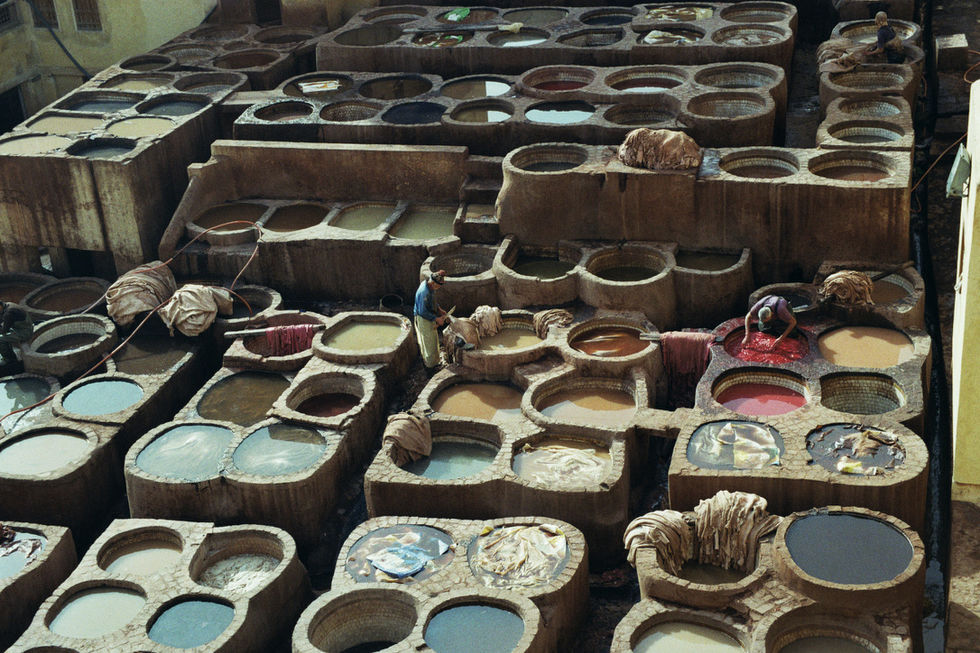 Curing and Dyeing leather at the tannery in Fez Medina, Morocco
