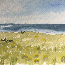 Watercolor painting of a beach with ocean waves, blue sky, and green grass.
